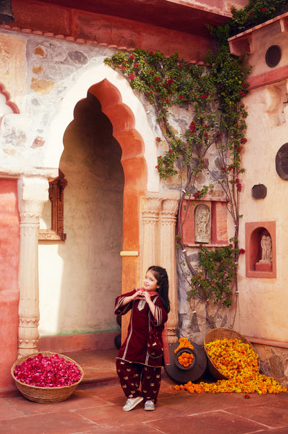 Maroon kurta with matching salwar and dupatta