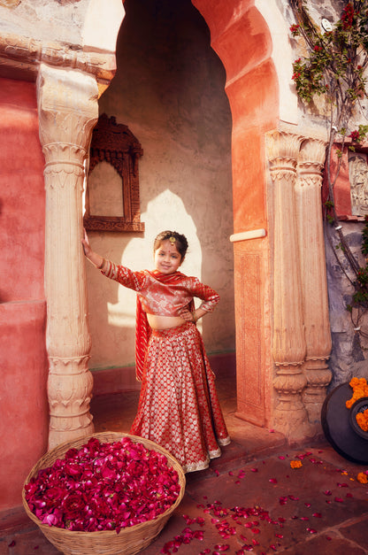 Orange brocade Lehenga with matching Choli and dupatta
