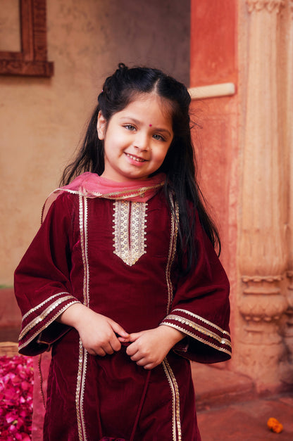 Maroon kurta with matching salwar and dupatta